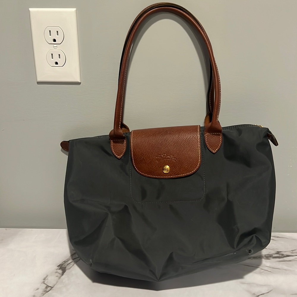 Grayish black medium size longchamp bag